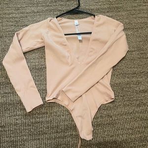 Out from under body suit